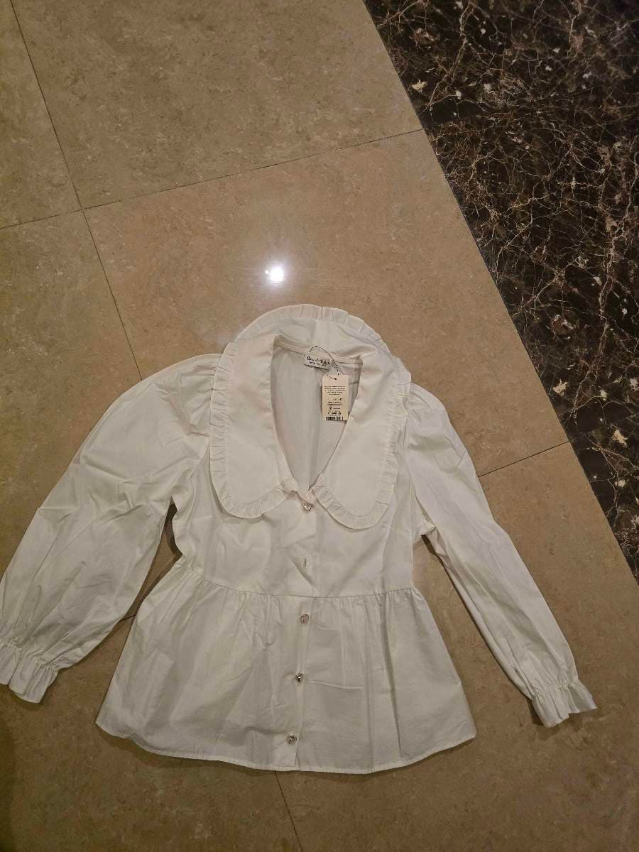 White Ruffled Peplum Blouse