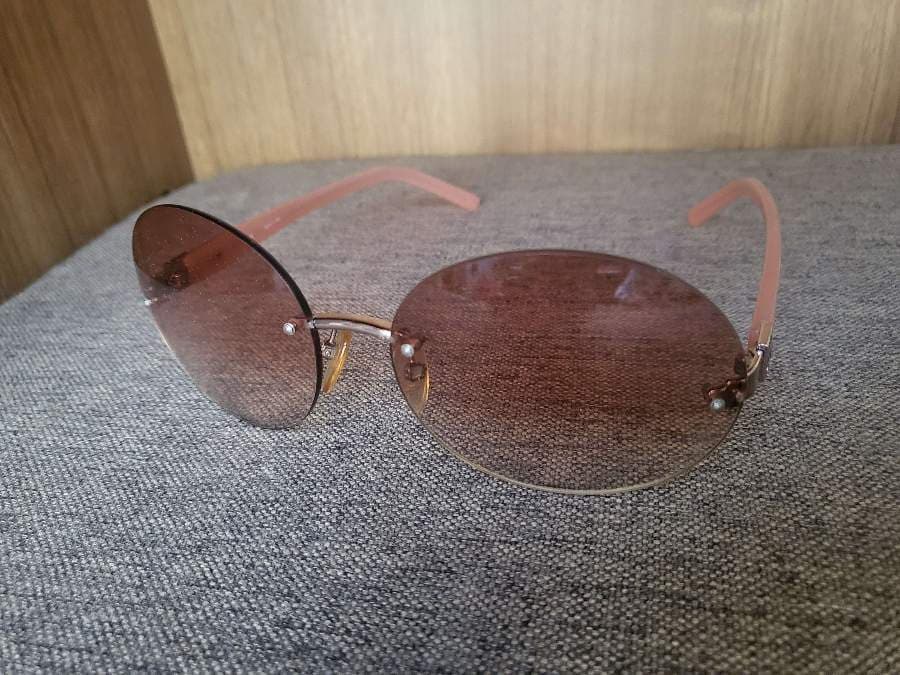 Celini Rimless Oval Sunglasses