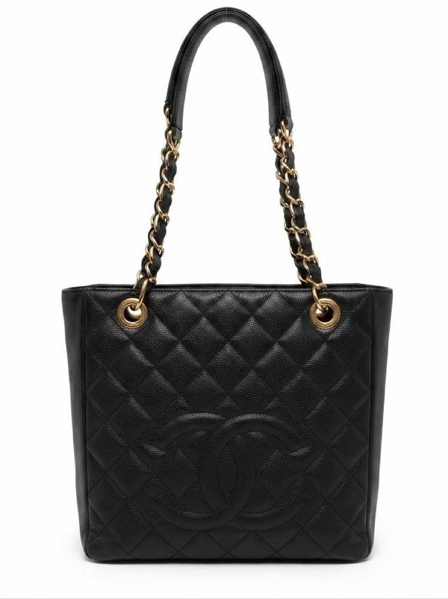 Chanel Petite Shopping Tote (PST) in black quilted caviar leather.
